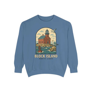 Blue long-sleeve crewneck sweatshirt with colorful lighthouse and ocean graphic for men