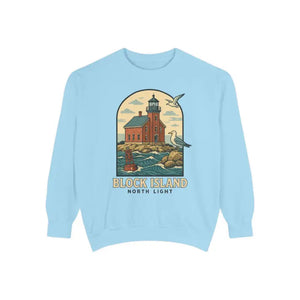 Light blue long sleeve crewneck sweatshirt with colorful lighthouse, ocean, and seagulls graphic