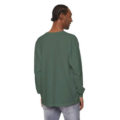 Man in a green long-sleeve shirt featuring Dont Be a Dumb Bass graphic design