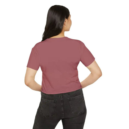 Woman in a mauve Mama Crop Top paired with black jeans for stylish moms