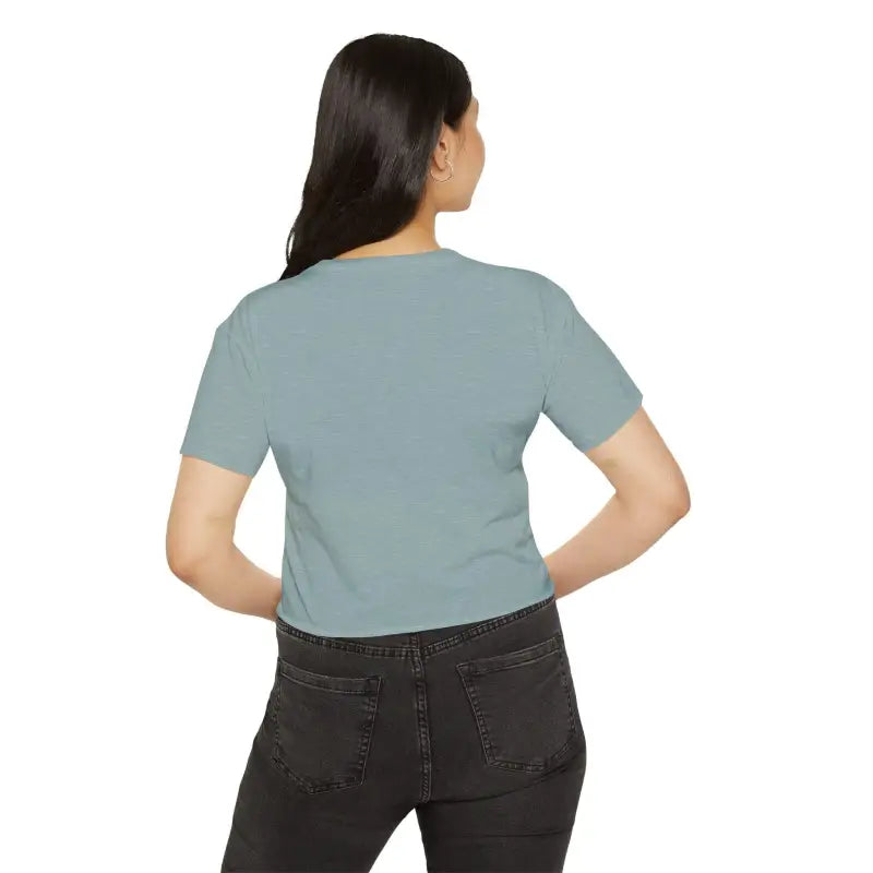 Woman in light blue Mama Crop Top and dark jeans showcasing stylish mom fashion