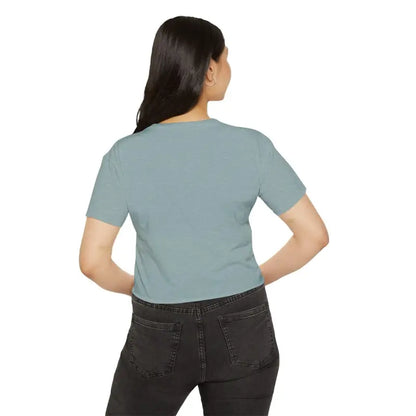 Woman in light blue Mama Crop Top and dark jeans showcasing stylish mom fashion