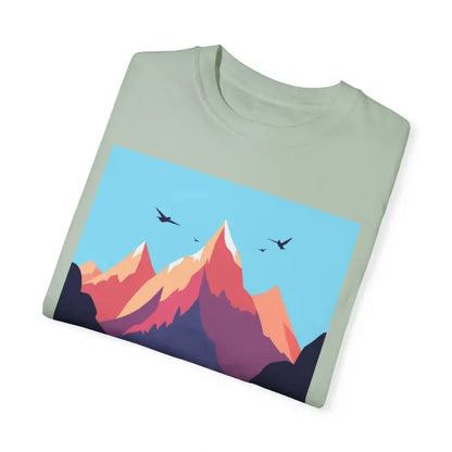 Folded light green t-shirt featuring mountain graphic designed for hiking and skiing