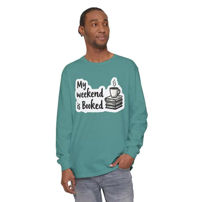 Long-sleeved teal shirt featuring ’My Weekend is Booked’ design for unisex wear