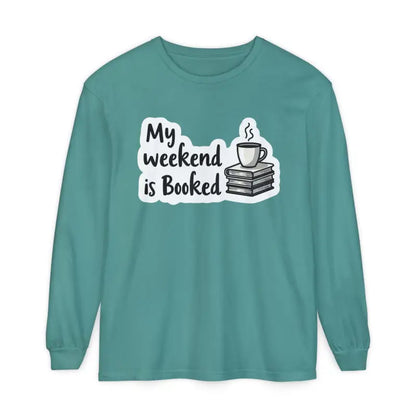 Teal long-sleeved shirt featuring a book and coffee graphic for My Weekend is Booked