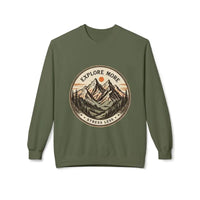 Olive green crewneck sweatshirt with mountain and forest design, explore more stress less slogan