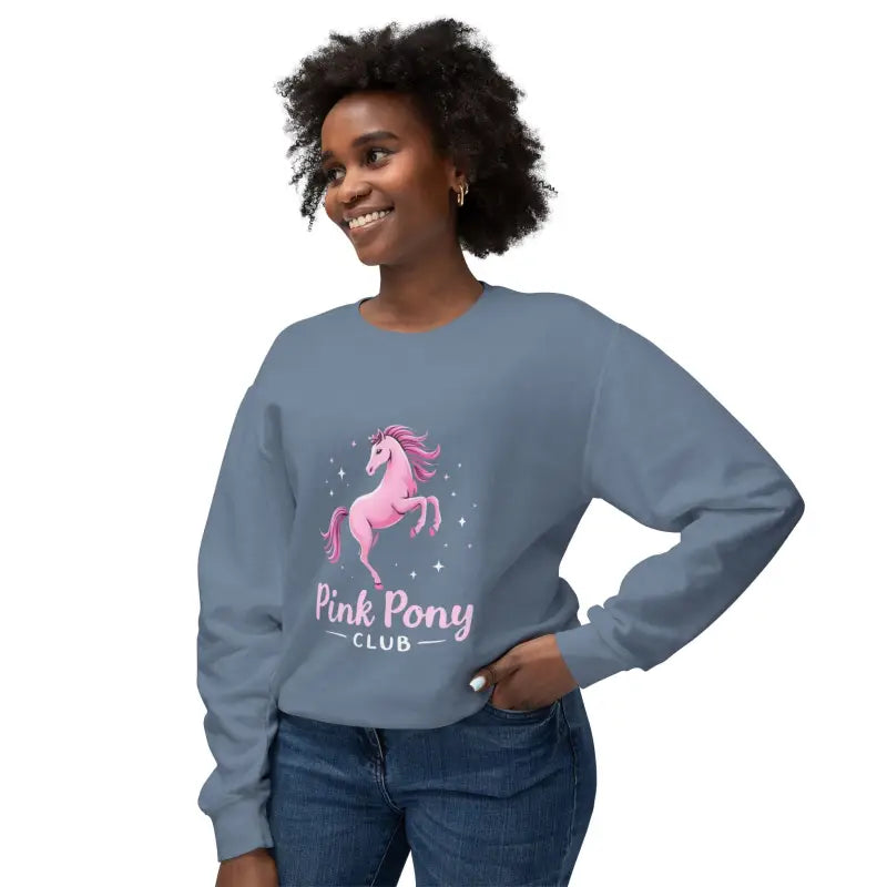 Woman wearing a blue crew-neck sweatshirt with a pink pony graphic from Pink Pony Graphic Crewneck Sweatshirts