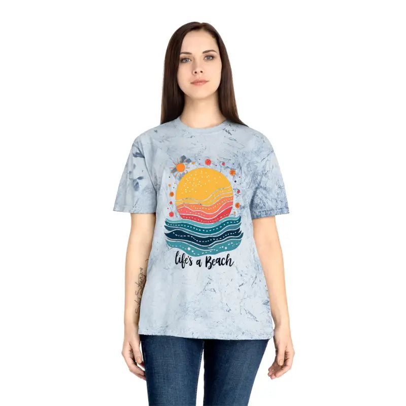 Woman in a pink tie dye t-shirt featuring the phrase Life’s a Beach