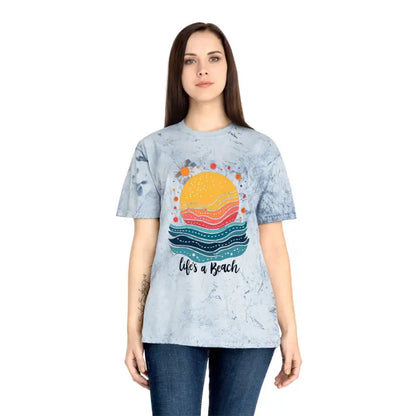 Woman in a pink tie dye t-shirt featuring the phrase Life’s a Beach