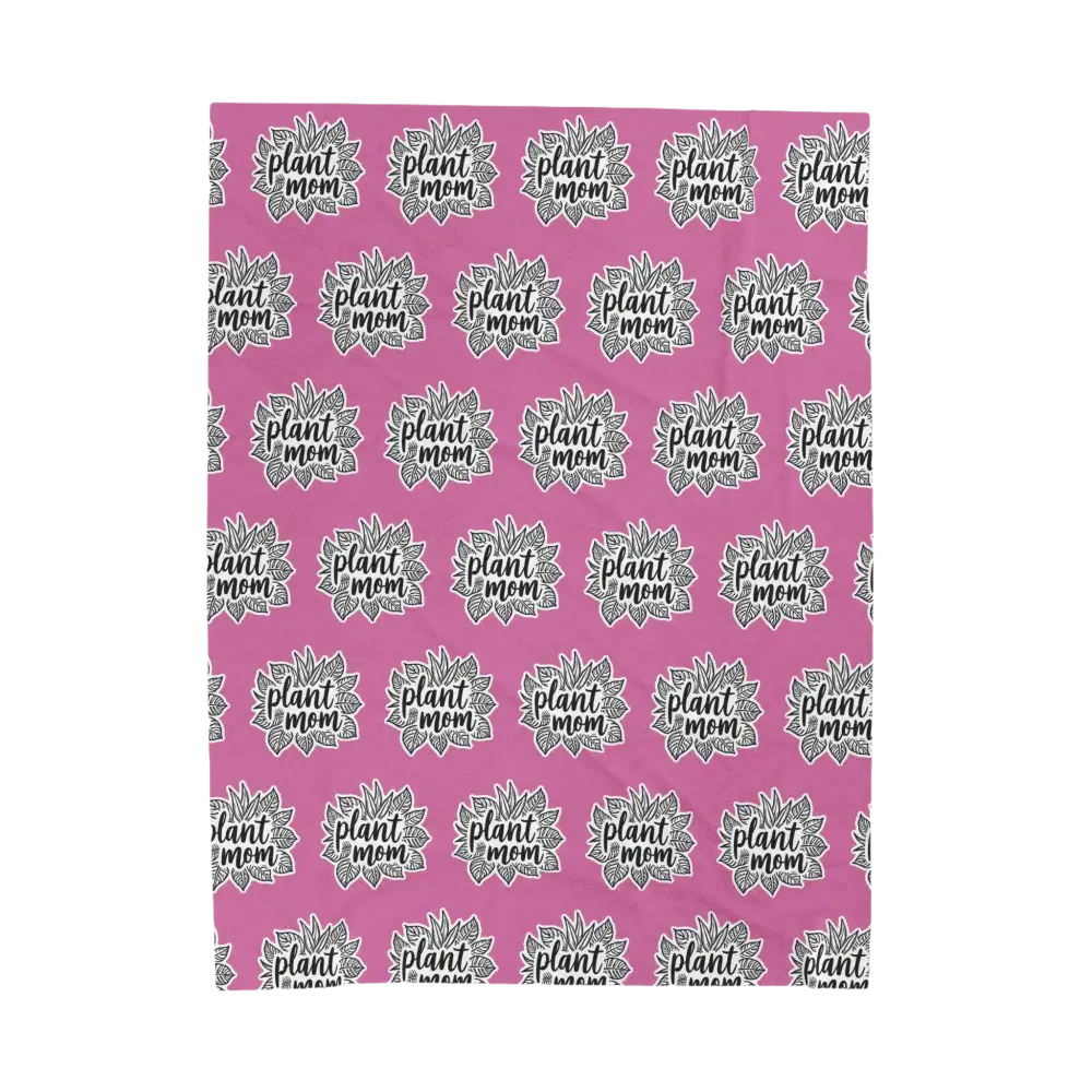 Plush Pink Blanket with Plant Mom Pattern displayed elegantly on a cozy surface