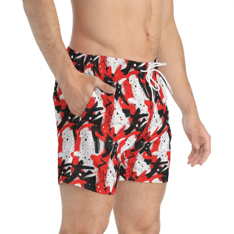 Patterned men’s swim trunks in vibrant red and black displayed on a product page