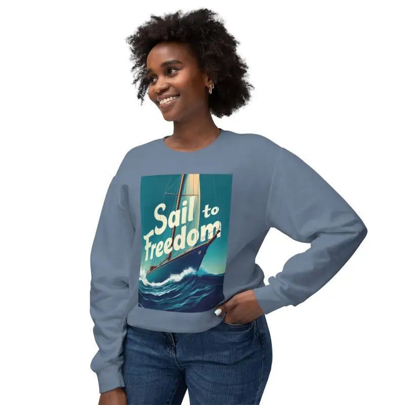 Blue sweatshirt featuring a sailboat graphic from the Sail to Freedom Nautical Collection