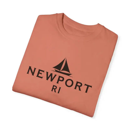 Folded salmon-colored T-shirt featuring Sailboat design for Newport RI beach lovers