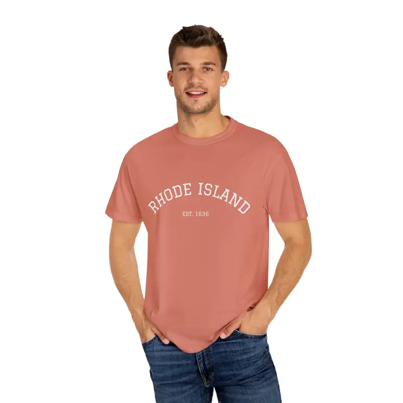 Male model wearing short sleeve crew neck T shirt in Salmon Terracotta paired with dark blue jeans