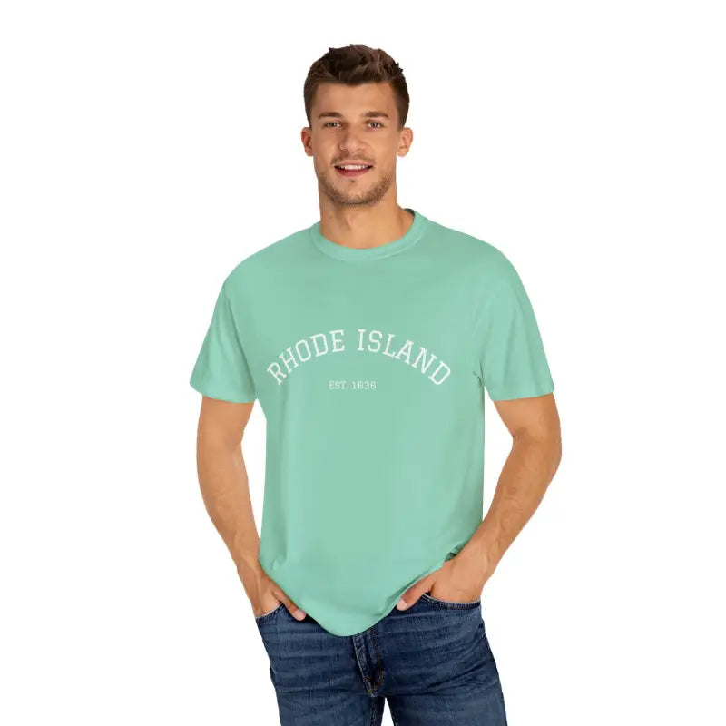 Man wearing mint green short sleeve crew neck T shirt with Rhode Island Est 1636 print