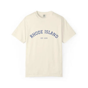 Cream-colored T-shirt with Rhode Island Established 1636 printed in blue, short sleeve crew neck style