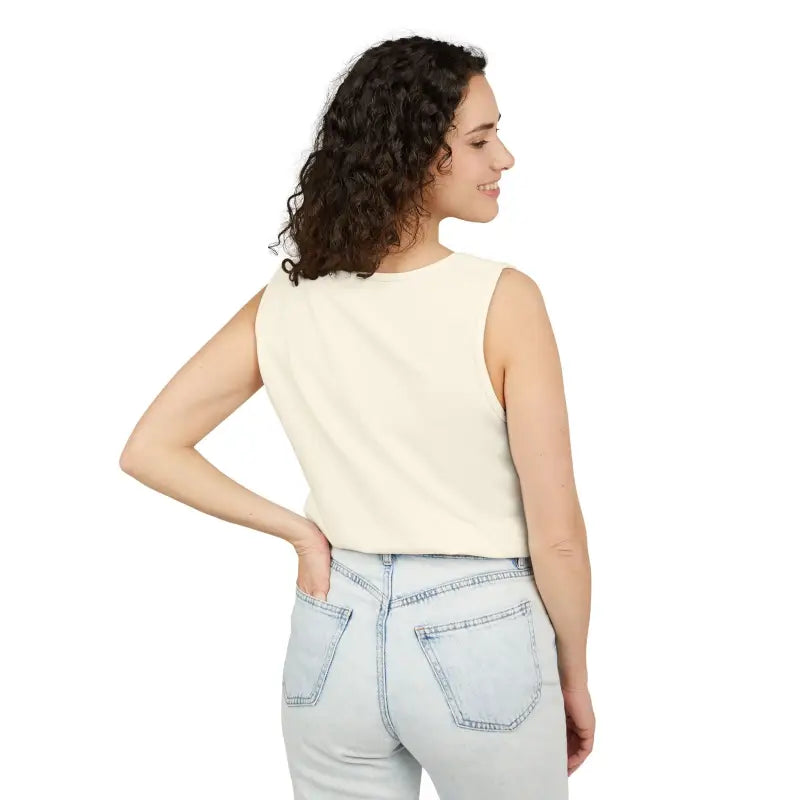 Woman wearing a cream-colored sleeveless crop top and light blue jeans for Sunflower Tank Tops in White Cream and Teal