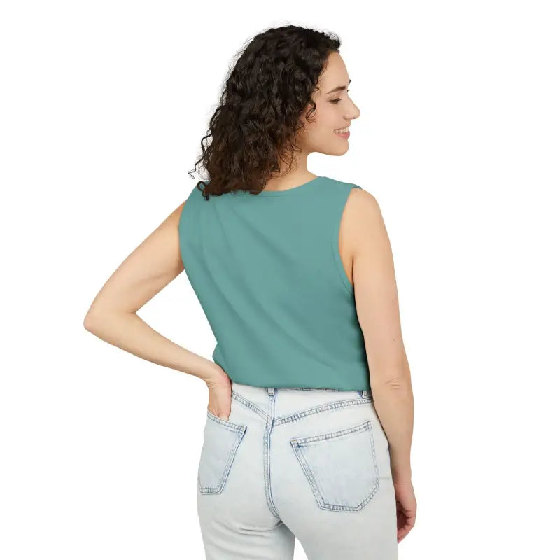 Woman wearing teal Sunflower Tank Top and light wash jeans showcasing casual style