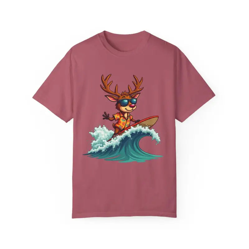 Mauve Surfing Reindeer T Shirt featuring a playful graphic of a reindeer on a surfboard