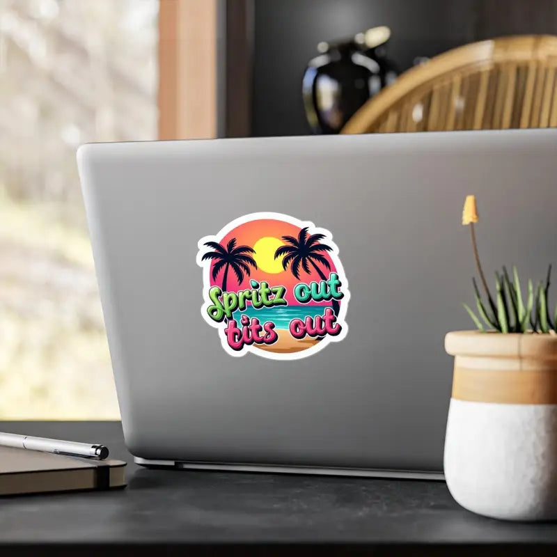Tropical Sunset Neon Vinyl Sticker featuring a vibrant beach scene on a laptop