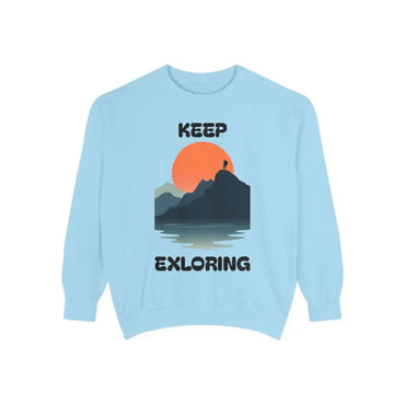 Light blue Unisex Garment Dyed Mountain Graphic Sweatshirt displayed on a neutral background