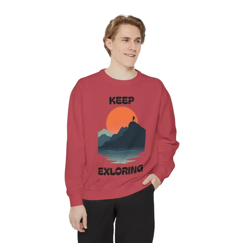 Red sweatshirt featuring mountain graphic from Unisex Garment Dyed collection