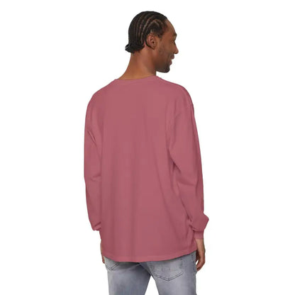 Man wearing a long-sleeved rose-colored shirt featuring a sailboat graphic design