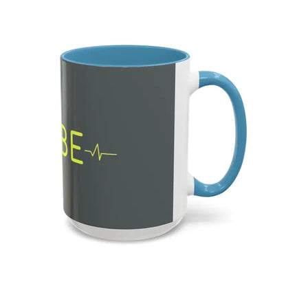 Two-tone Vibe Coffee Mug featuring heartbeat graphic in pink and blue interiors