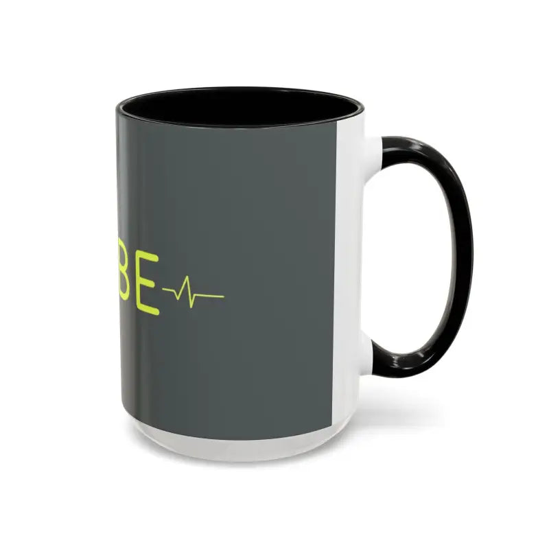 Gray and white Vibe Coffee Mug with pink and blue interiors on display