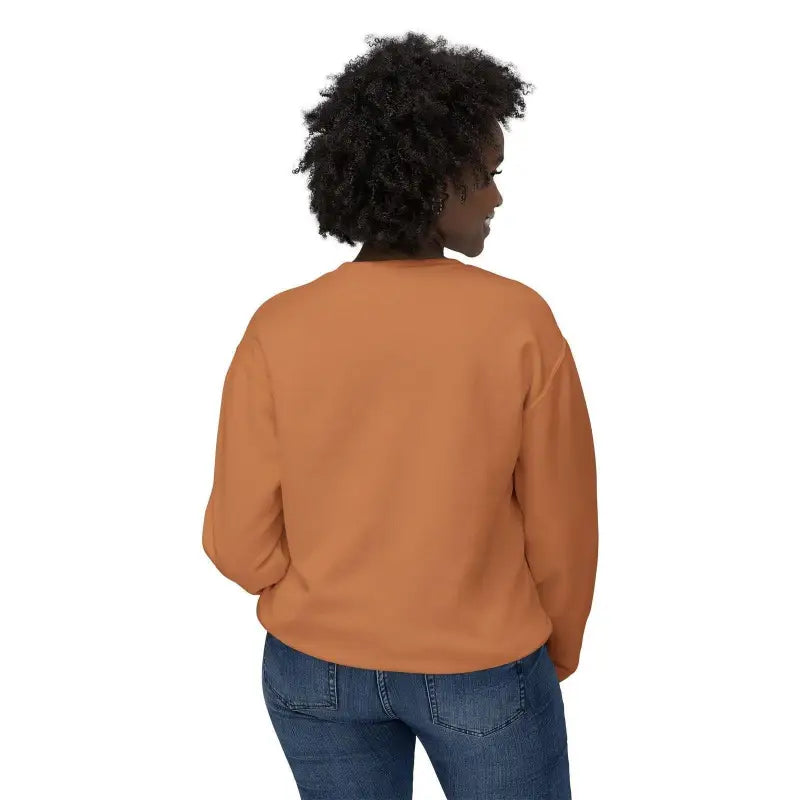Woman wearing an orange sweatshirt styled with a White All Out of Clucks Crewneck