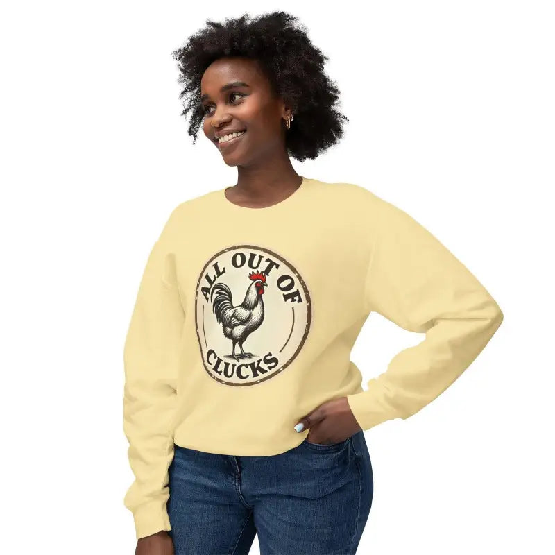 Yellow sweatshirt featuring a chicken graphic from the White All Out of Clucks Crewneck
