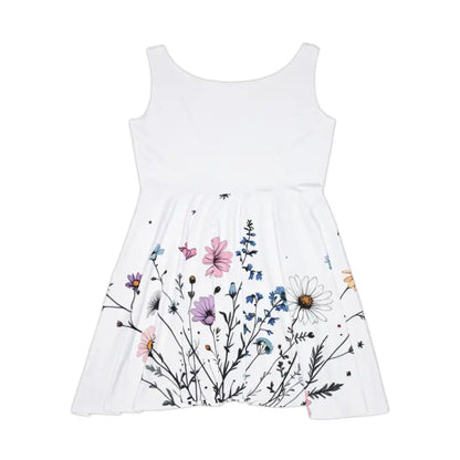 White sleeveless dress featuring a vibrant floral print, ideal for summer occasions