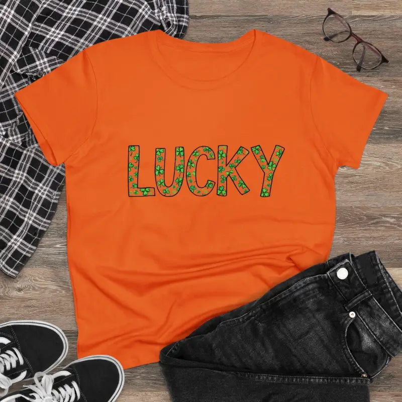Orange Women Lucky Shamrock Tee featuring shamrock lettering for St Patrick’s Day