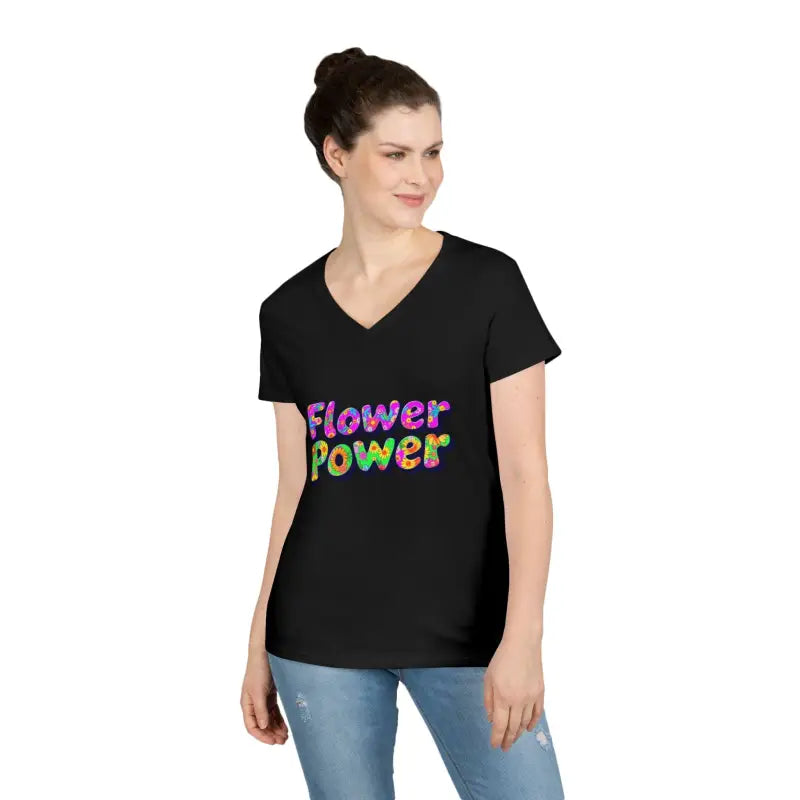 Woman wearing a black V-neck Flower Power T-shirt and blue jeans
