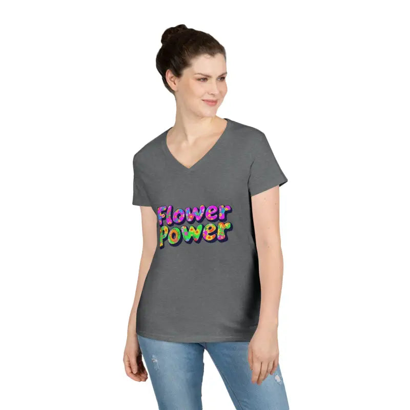 Woman wearing dark gray V-neck T-shirt with Flower Power colorful lettering